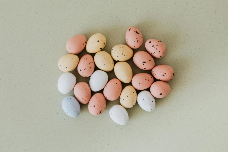 small speckled eggs arranged in a heart shape, trending on pexels, mingei, light blush, mix, thumbnail, mint