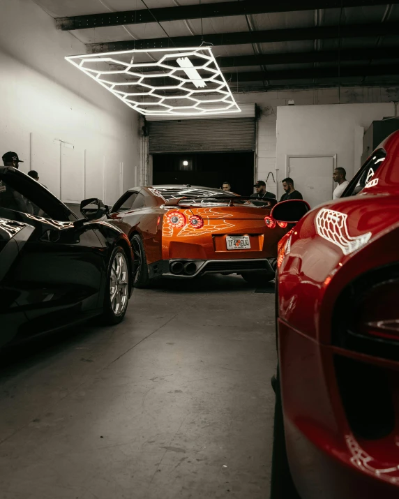 a couple of cars are parked in a garage, inside of a car, many exotic cars, lit from behind, profile image