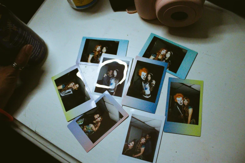 a bunch of polaroids sitting on top of a table, holography, katherine mcnamara inspired, lo fi colors, college party, behind the scenes photo