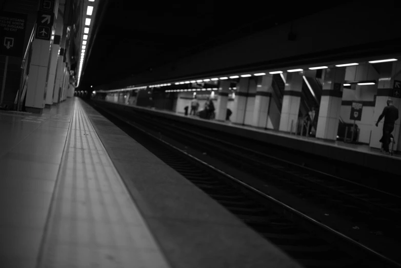a black and white photo of a train station, unsplash, postminimalism, underground!!!!, square lines, ligne claire, taken in the late 2000s