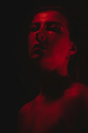 a woman with a red light on her face, inspired by Elsa Bleda, digital art, promo image, red monochrome, cinematic body shot, avatar image