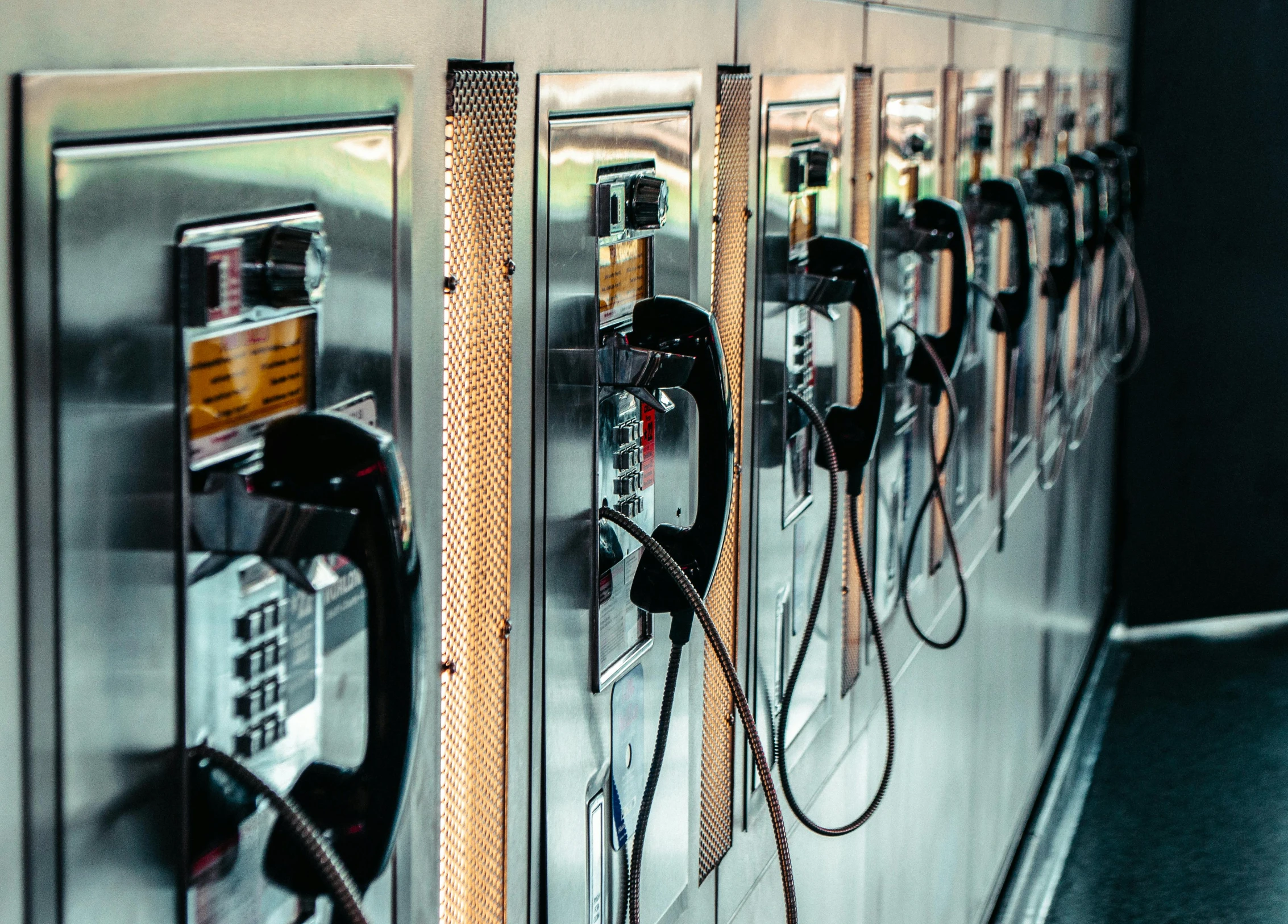 a row of pay phones sitting next to each other, trending on pexels, hyperrealism, hoses, liquid gold, thumbnail, 1 2 9 7