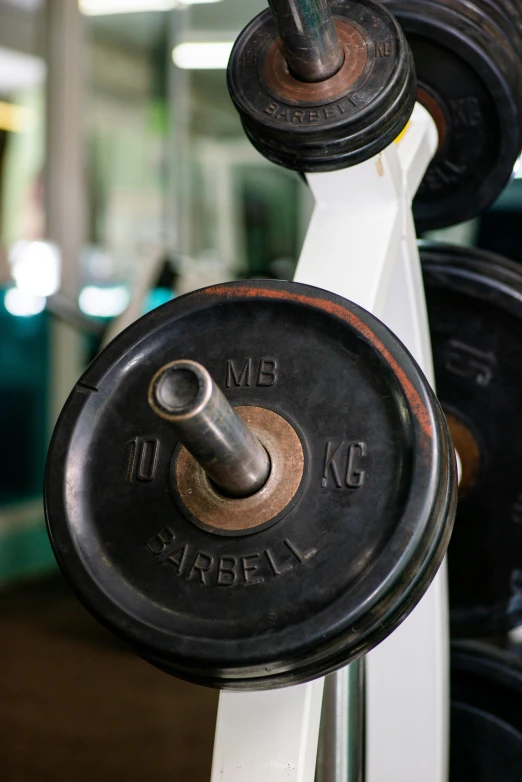 a close up of a barbell in a gym, an album cover, thailand, lifting weights, thumbnail, dingy gym
