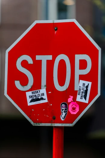 a close up of a stop sign with stickers on it, by Andrew Stevovich, graffiti, ap news photograph, shot on sony a 7, death grips, ap press photo