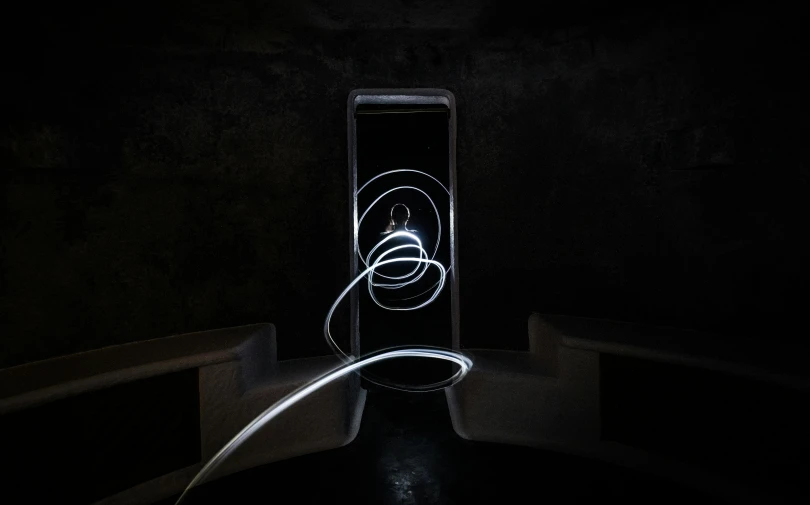 a cell phone sitting on top of a table, inspired by Oskar Schlemmer, unsplash contest winner, light and space, diffuse lightpainting, portal. zaha hadid, in a claustrophobic, alessio albi