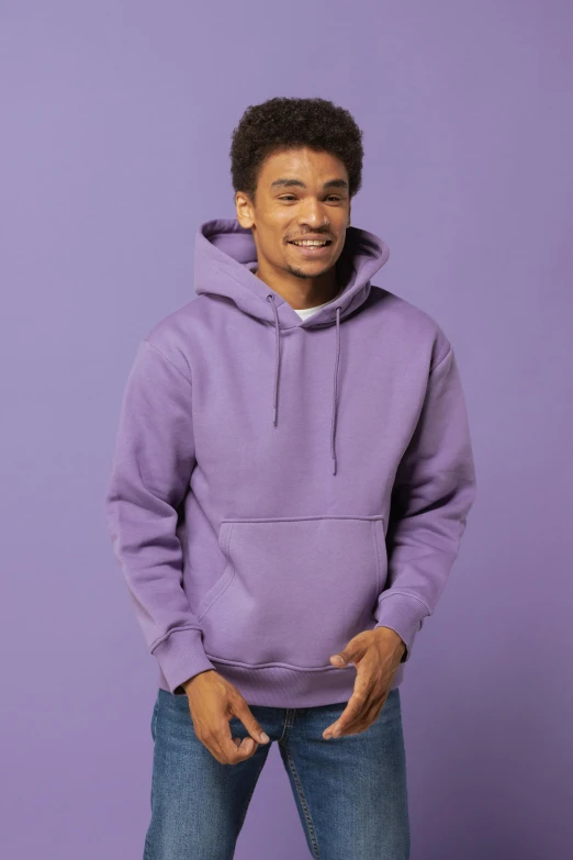 a young man in a purple hoodie standing with his hands in his pockets, trending on pexels, renaissance, pastel clothing, wearing a grey hooded sweatshirt, full colour print, ((purple))