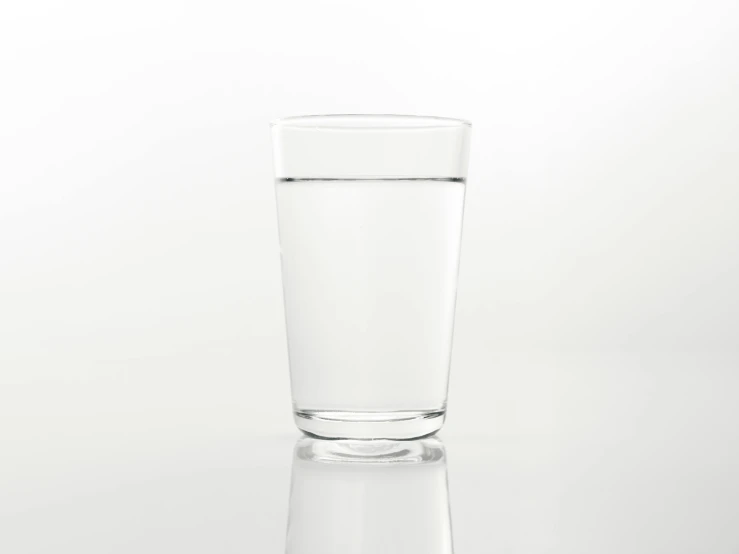 a glass of water sitting on top of a table, by Shinji Aramaki, minimalism, basic white background, fan favorite, product introduction photo