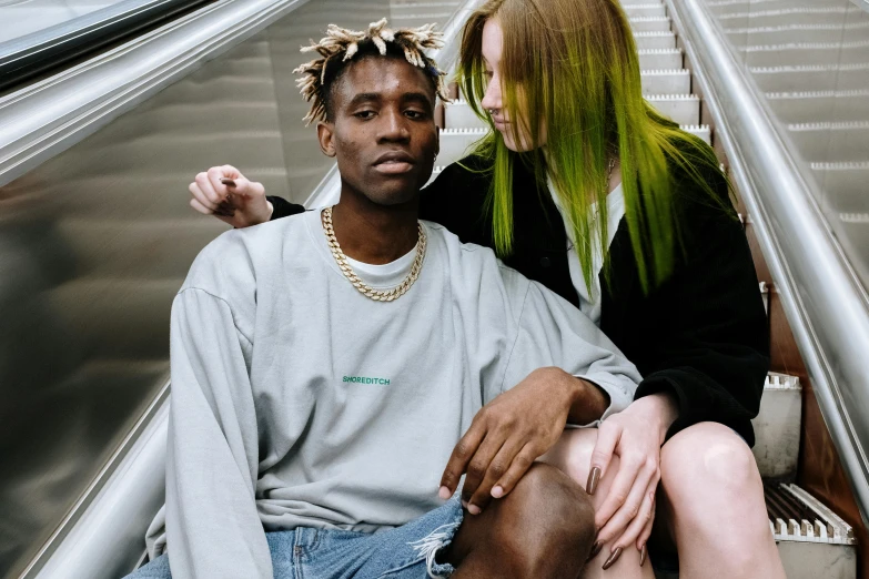 a man sitting next to a woman on an escalator, trending on pexels, realism, green hair, heron preston, lesbians, teddy fresh