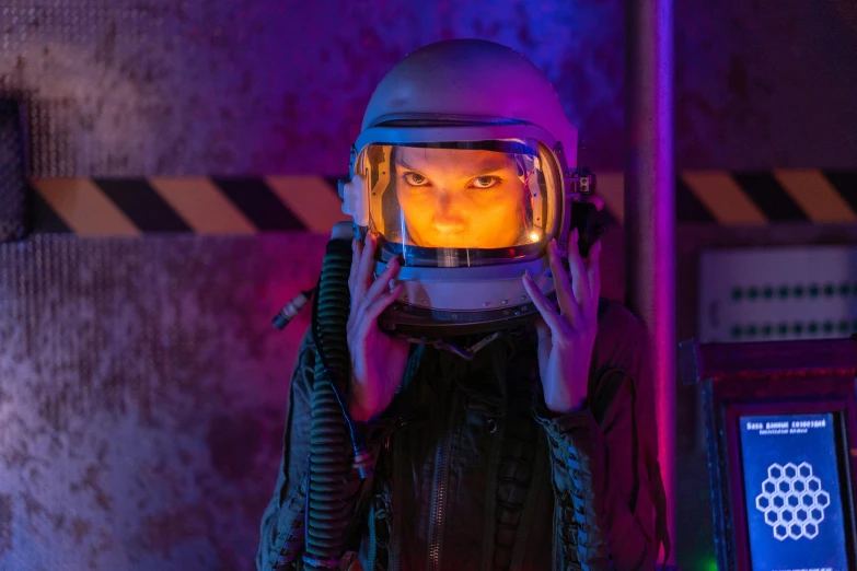 a woman in a space suit talking on a cell phone, pexels contest winner, afrofuturism, dafne keen, wearing apocalyptic clothes, glowing eyes in helmet, emma watson vietnam door gunner