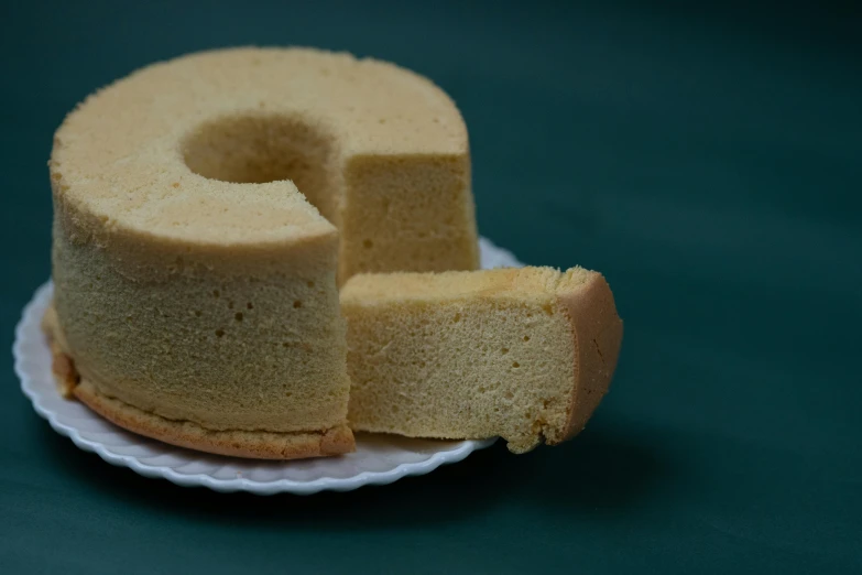 a piece of cake sitting on top of a white plate, rondel, 王琛, ready-made, sponge