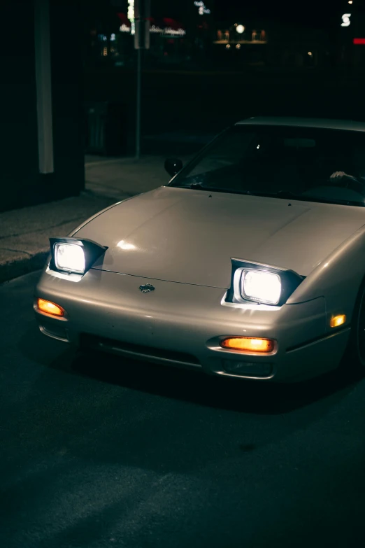 a car parked in a parking lot at night, an album cover, inspired by Zhu Da, unsplash, renaissance, custom headlights, jdm, whiteout eyes, square nose