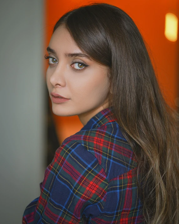 a woman with long hair wearing a plaid shirt, pexels contest winner, hurufiyya, looks like ebru şahin, queer woman, actress, trending photo