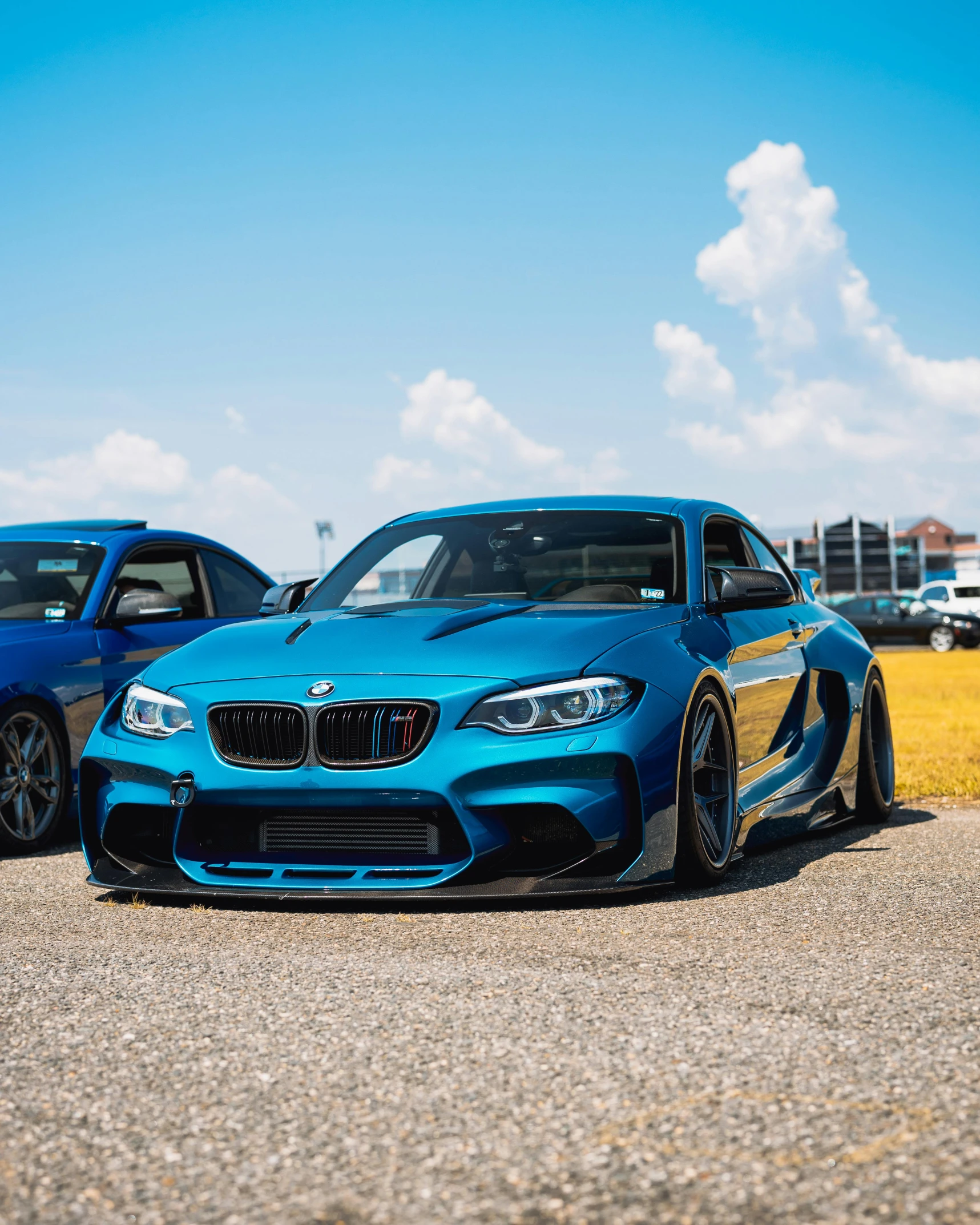 a couple of blue cars parked next to each other, by Adam Rex, pexels contest winner, renaissance, on a street race track, bmw, square, profile image