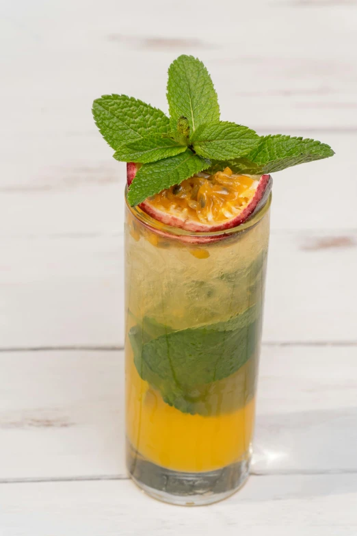 a close up of a drink in a glass on a table, diego koi, mint, passion fruits, birdseye view