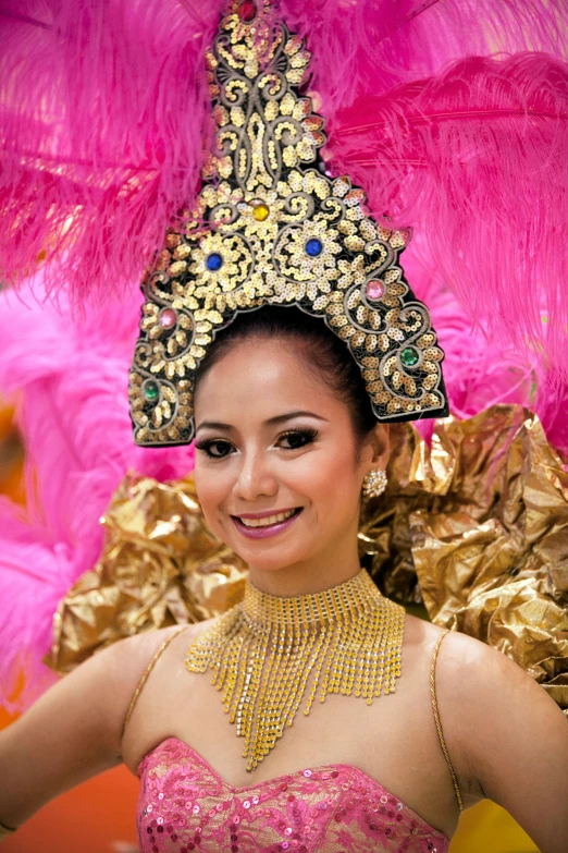 a close up of a person wearing a costume, sumatraism, pink and gold color scheme, miss universe, square, february)