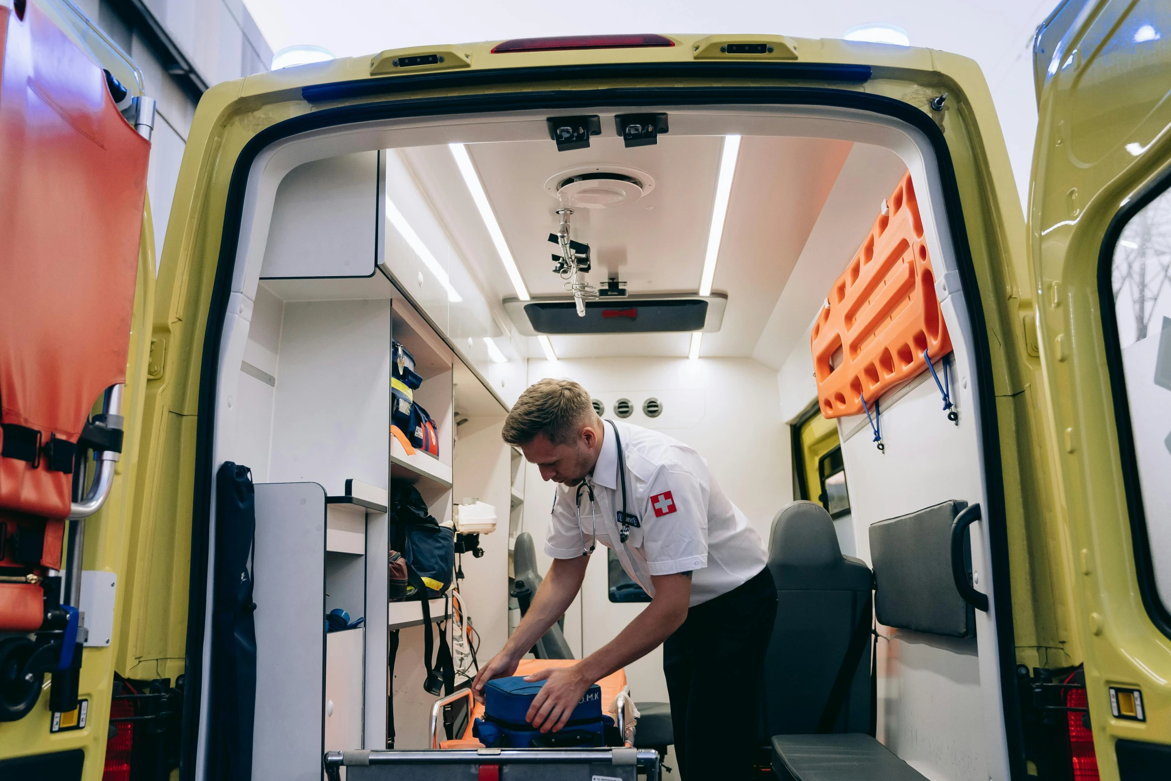 a man that is standing in the back of a van, ambulance, unsplash photo contest winner, on an operating table, profile image