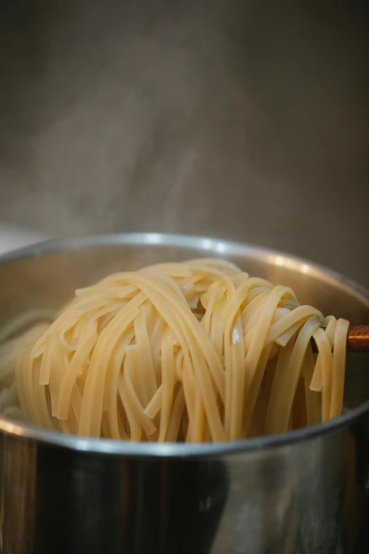 a pot filled with pasta sitting on top of a stove, close up of lain iwakura, 王琛, crisp lines, vanilla