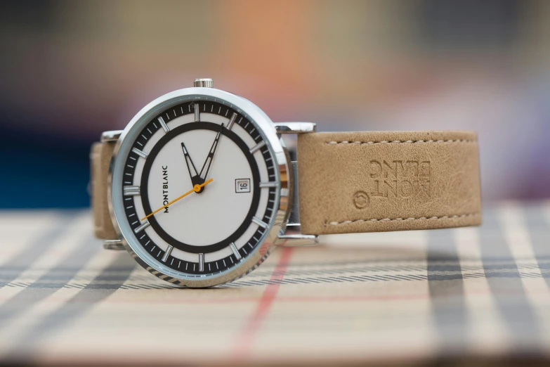 a close up of a watch on a table, a portrait, flickr, funtime corporation branding, beige, inuk, leather straps