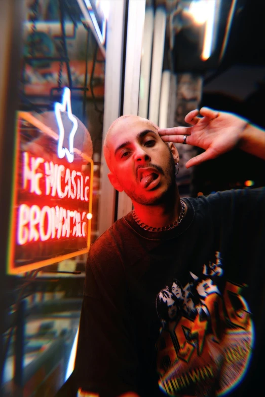 a man that is standing in front of a window, an album cover, unsplash, lowbrow, brown buzzcut, high red lights, pointing, westside