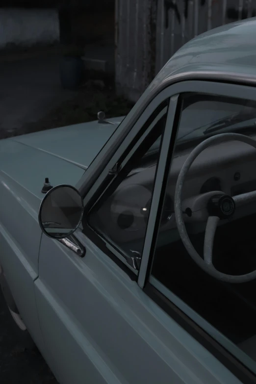 a close up of a car with a steering wheel, an album cover, inspired by Elsa Bleda, polycount, photorealism, soviet interior, solo performance unreal engine, inside mirror, todd hido