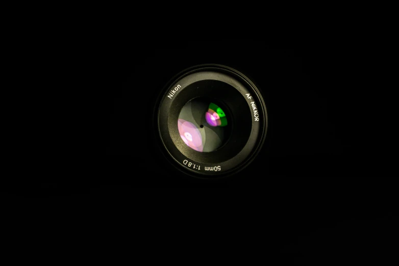 a close up of a camera lens in the dark, a picture, by Mathias Kollros, unsplash, photorealism, f / 1. 9 6. 8 1 mm iso 4 0, [ realistic photography ], today\'s featured photograph 4k, detailed medium format photo