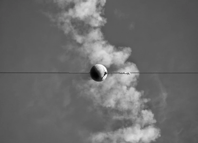 a black and white photo of a ball on a wire, eclipse, egor letov, nice weather, fine art print