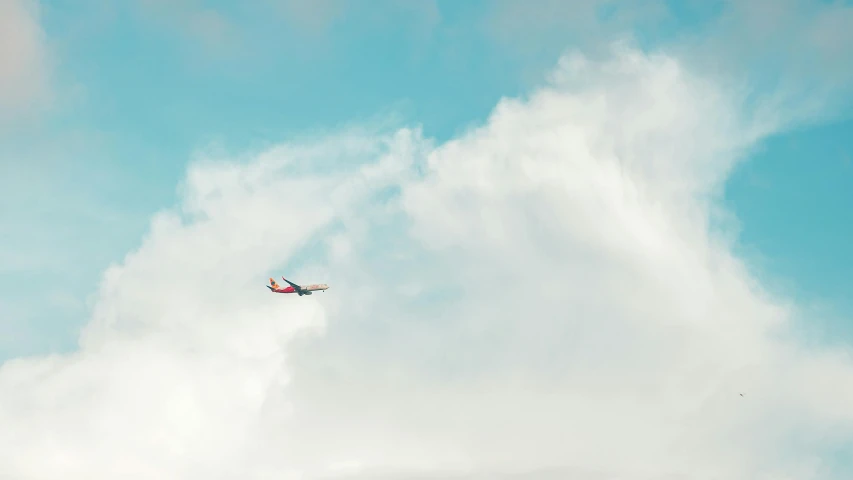 an airplane flying through a cloudy blue sky, pexels contest winner, minimalism, concert, mixed art, 9, low