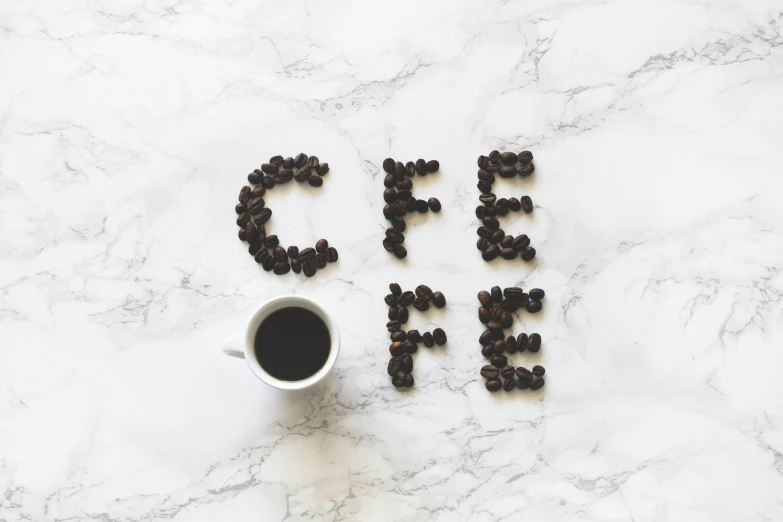 a cup of coffee with the word coffee spelled out of coffee beans, inspired by Ceferí Olivé, pexels contest winner, while marble, instagram post, well fed, clean minimalist design