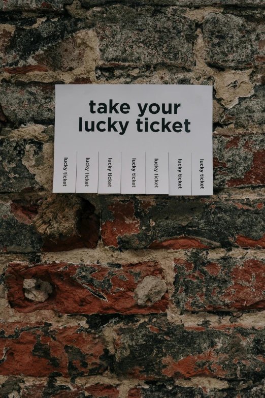 a sign on a brick wall that says take your lucky ticket, pexels contest winner, fluxus, thumbnail, flatlay, long, indie