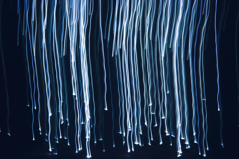 blue and white light streaks on a black background, inspired by Bruce Munro, pexels, lyrical abstraction, ethereal white dripping tar, wires hanging, abstract texture, shooting stars