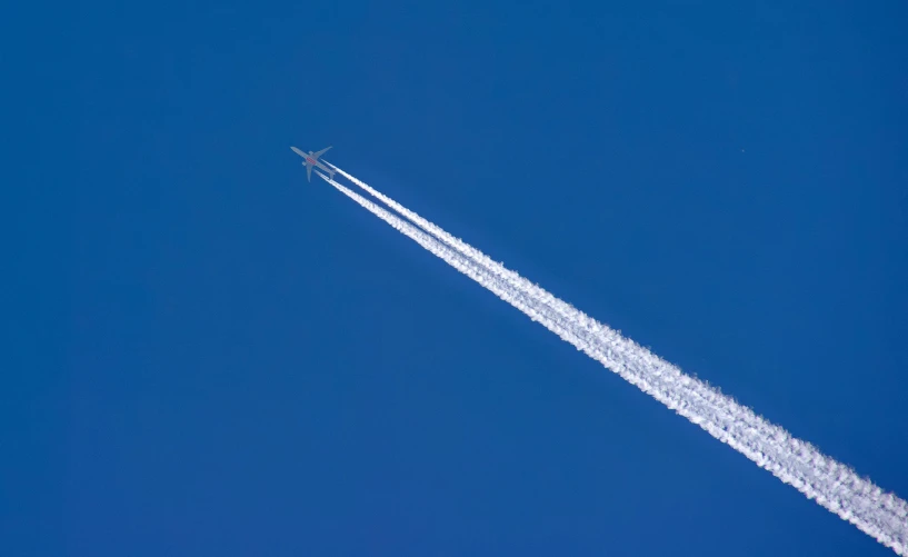 a large jetliner flying through a blue sky, by Julian Allen, pexels contest winner, auto-destructive art, top down perspecrive, spaghettification, cloudless-crear-sky, thumbnail