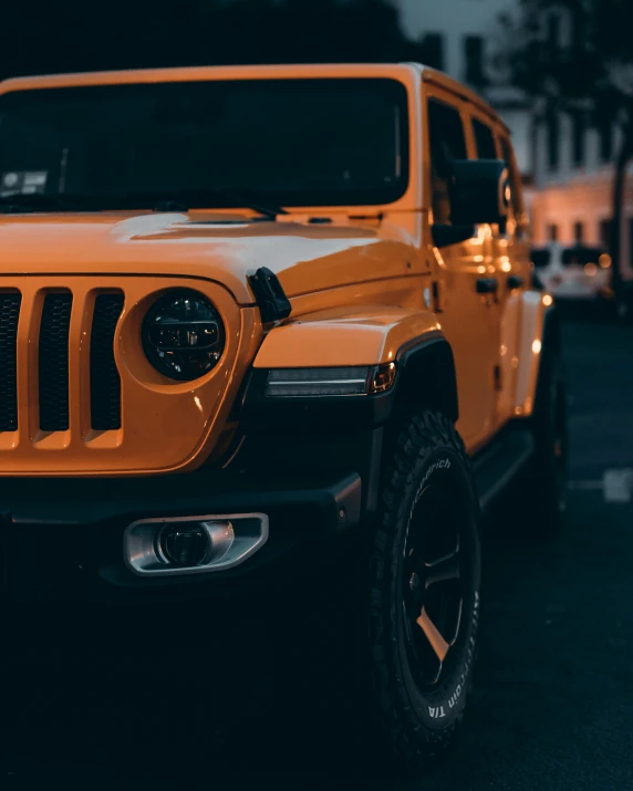 a yellow jeep parked in a parking lot, pexels contest winner, renaissance, orange and black tones, car with holographic paint, early evening, square