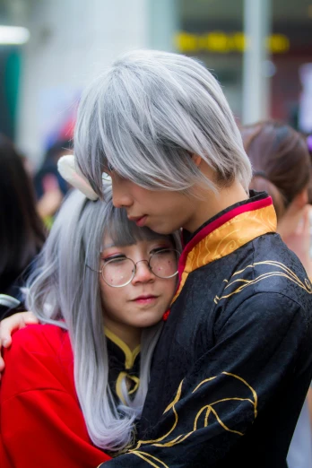 a couple of people that are hugging each other, a photo, by Kanbun Master, diverse costumes, grey hairs, fujifilm”
