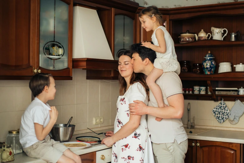 a man holding a little girl on his shoulders in a kitchen, pexels contest winner, renaissance, couple kissing, avatar image, a group of people, ukrainian