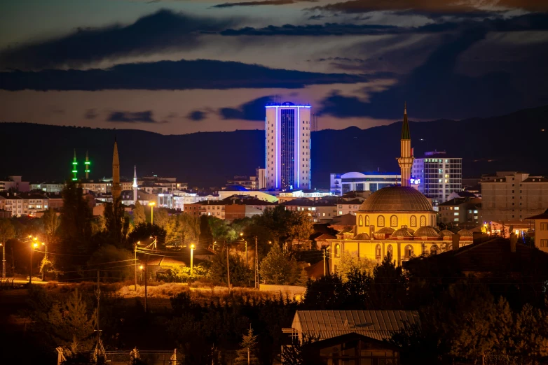 a city lit up at night with mountains in the background, hurufiyya, edin durmisevic, chesterfield, profile image, gigapixel photo