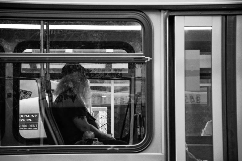 a black and white photo of a person on a bus, a black and white photo, transparent glass woman, train window, white haired lady, back and white