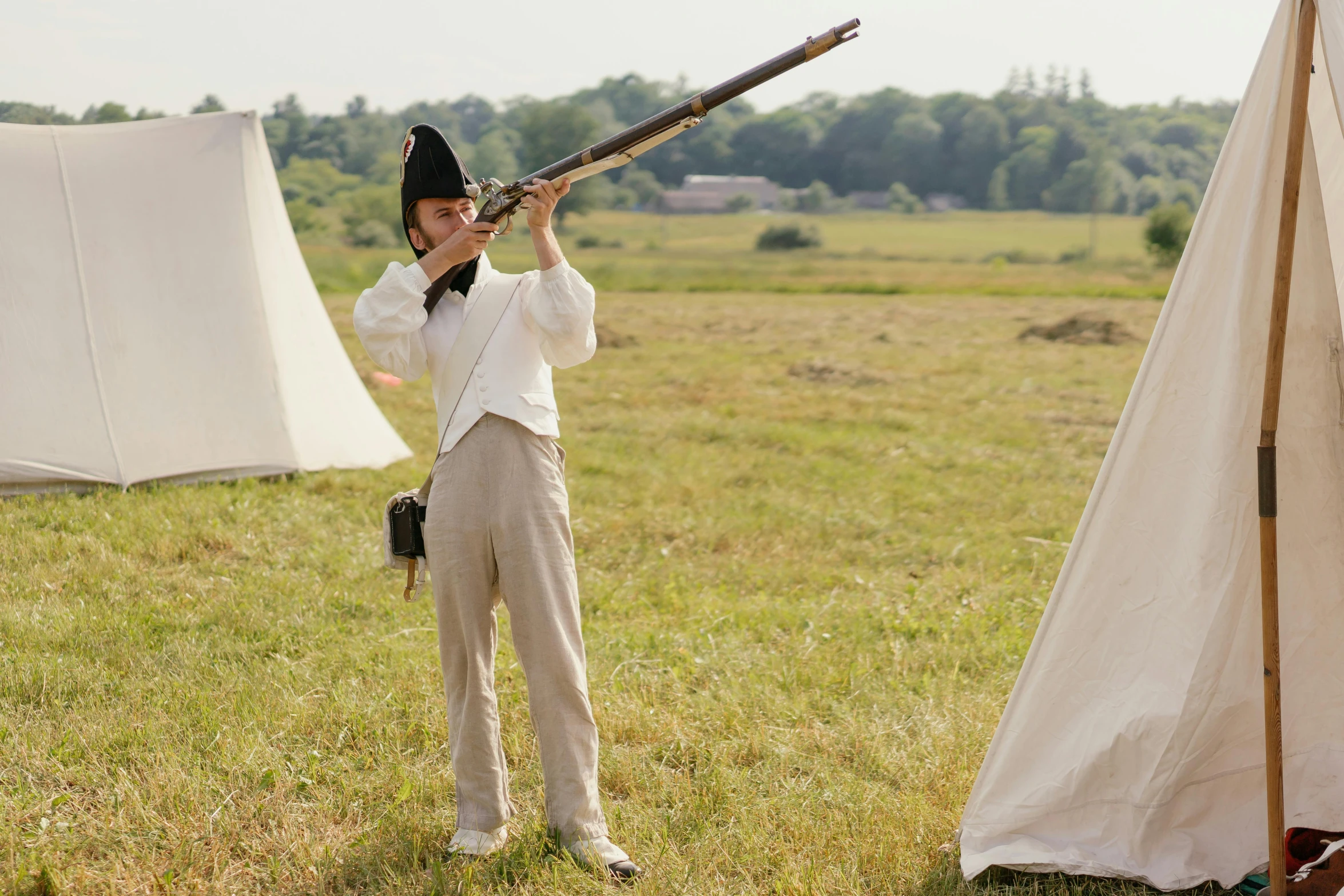 a man standing in a field holding a rifle, an album cover, inspired by Horace Vernet, private press, historical reenactment, white uniform, joe keery, slide show