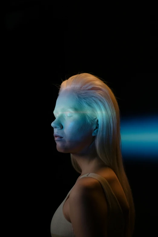 a woman with blue light on her face, an album cover, by Adam Marczyński, unsplash, holography, modeling photograph kerli koiv, photographed for reuters, looking to the side, your personal data avatar