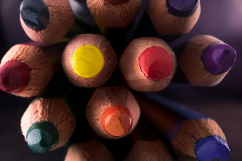 a close up of a bunch of colored pencils, a macro photograph, by Thomas Häfner, trending on pexels, crayon art, brown, diversity, three colors, looking towards camera