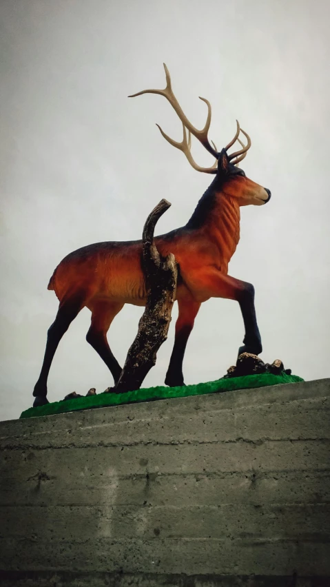 a statue of a deer on top of a building, 3 d print, j. dickenson, painted, preserved museum piece