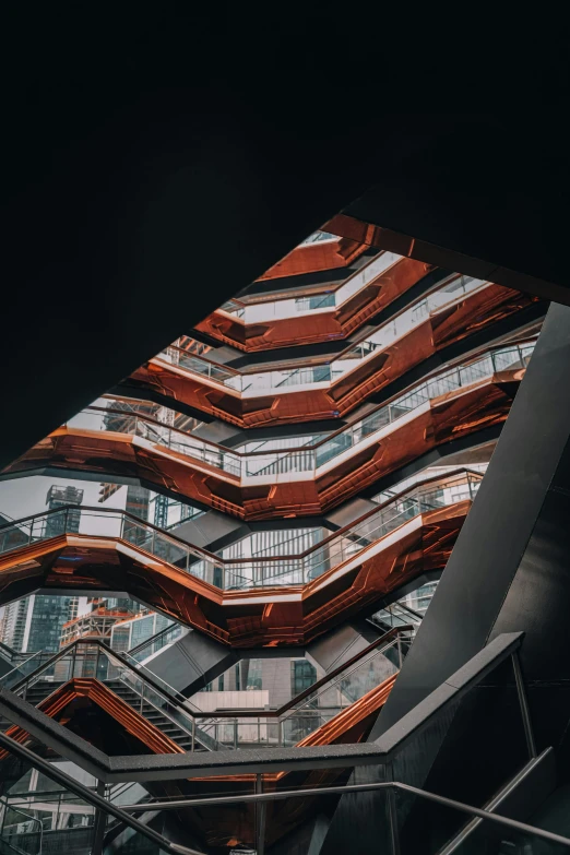 a very tall building with a lot of windows, a picture, inspired by Zaha Hadid, unsplash contest winner, modernism, staircase, red brown and white color scheme, new york buildings, inside a space ship