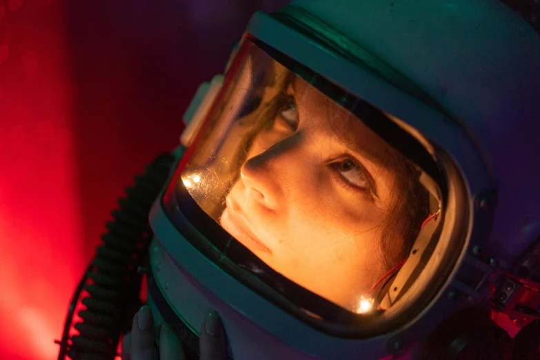 a close up of a person in a space suit, a portrait, pexels contest winner, amelie poulain, scene from starship, glow, set photo