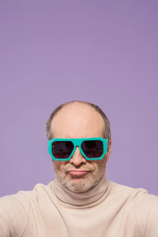 a man with a pair of sunglasses on his face, an album cover, inspired by Leo Leuppi, trending on pexels, neo-dada, mauve and cyan, bald patch, studio portrait photo, square face