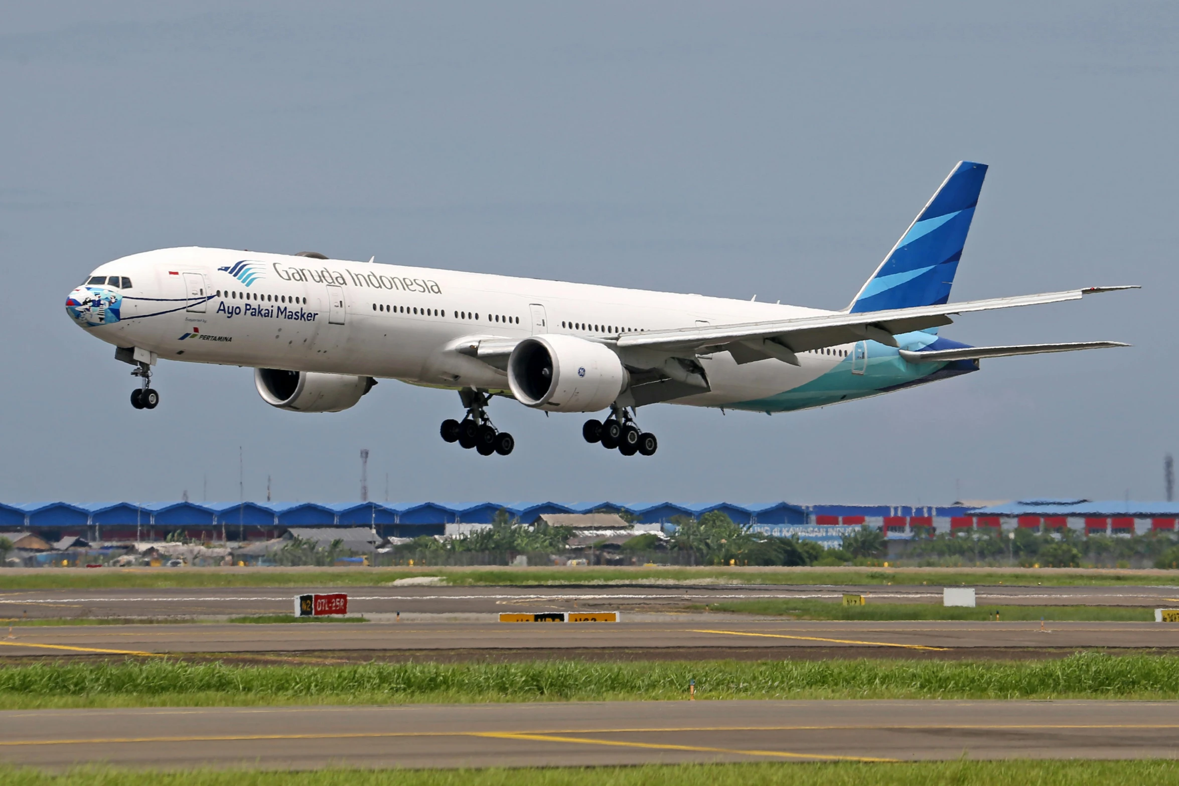 a large passenger jet taking off from an airport runway, by Randy Gallegos, sumatraism, avatar image, high quality image, blue, 💣 💥💣 💥