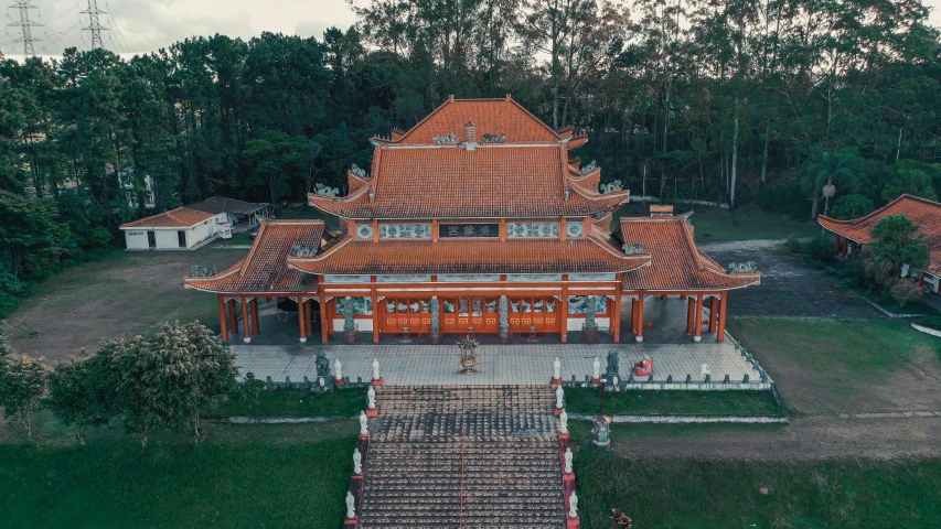 a large building sitting on top of a lush green field, pexels contest winner, vietnamese temple scene, avatar image, drone photo, square