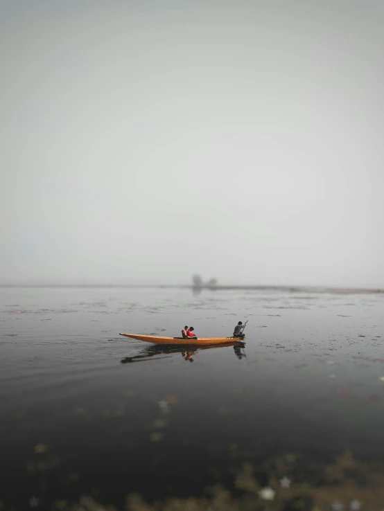a couple of people in a boat on a body of water, by Jaakko Mattila, under a gray foggy sky, paddle of water, low quality photo, teaser