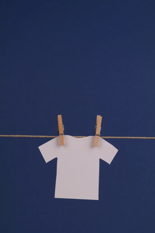 a white t - shirt hanging on a clothes line, a cartoon, inspired by Quint Buchholz, unsplash, postminimalism, made of paper, dark blue shirt, 15081959 21121991 01012000 4k, plain studio background