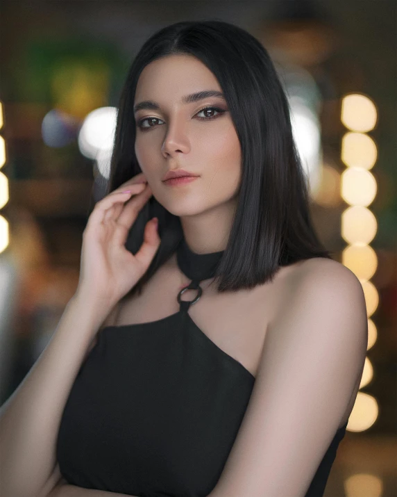 a woman in a black dress talking on a cell phone, a character portrait, inspired by Elsa Bleda, pexels contest winner, dau-al-set, dark hair and makeup, instagram post, malaysian, nonbinary model