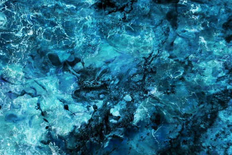 a close up of water with rocks in the background, an album cover, unsplash, abstract expressionism, blue bioluminescent plastics, realistic textures from photos, quixel textures, turbulent sea
