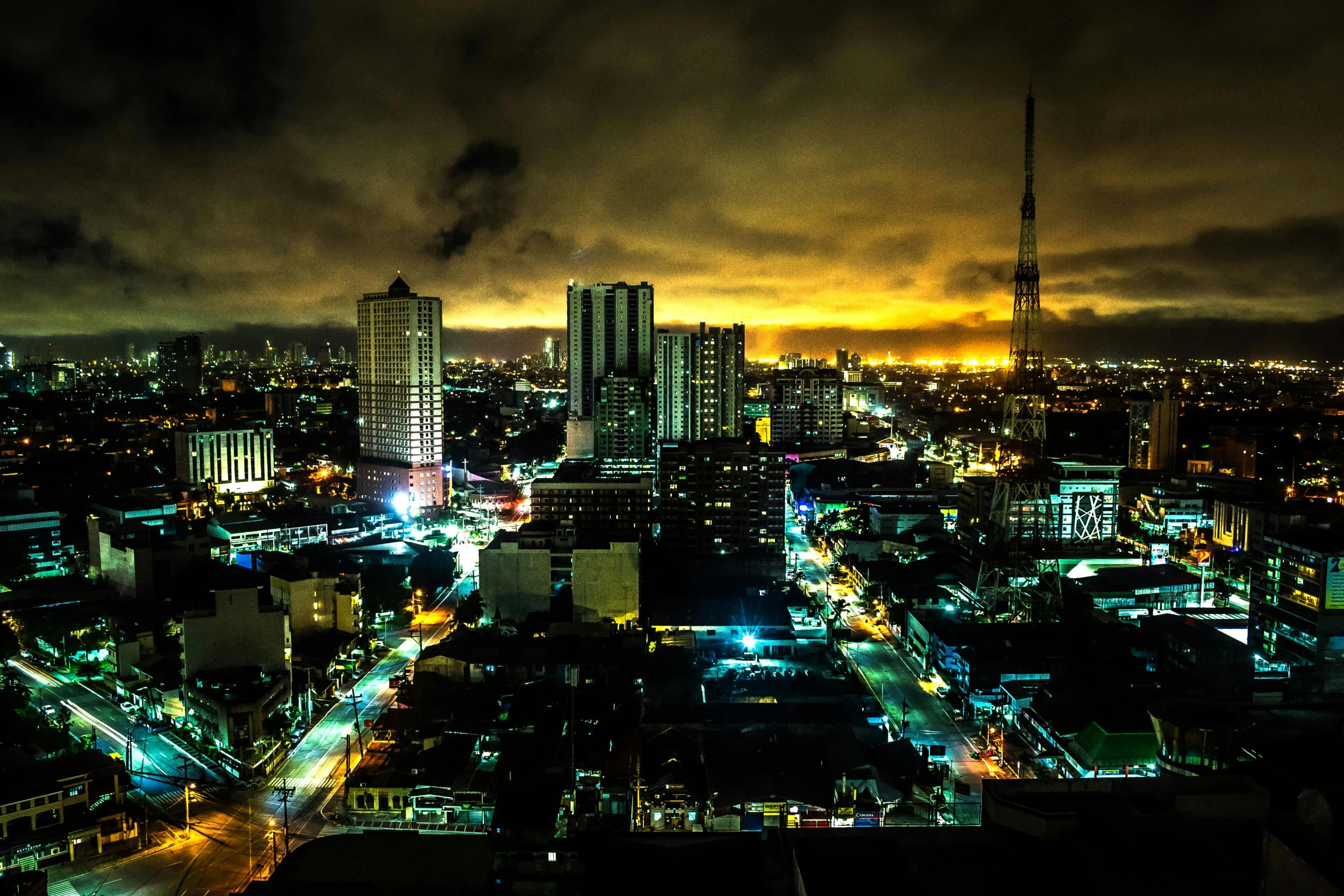 an aerial view of a city at night, an album cover, by Niklaus Manuel, pexels contest winner, manila, apocalyptik city, panoramic, post processed